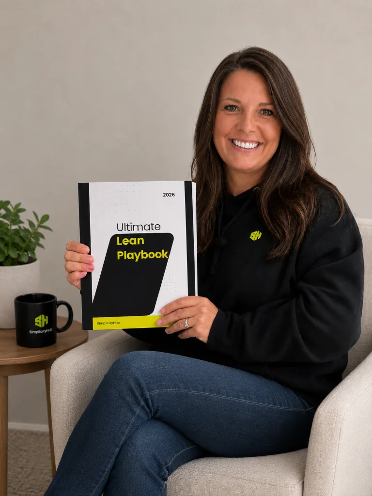 SimplicityHub founder holding The Ultimate Lean Playbook